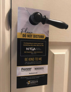 A conference doorhanger