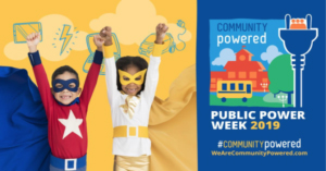 Two kids dressed as super hero with the phrase "community powered"