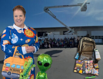 Sarah Johnson, dressed as Ms. Frizzle, with the backpack she gave students in 2025.