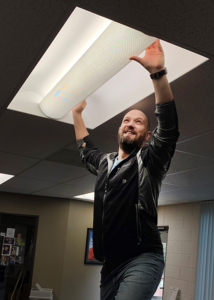 James installing efficiency LED lights